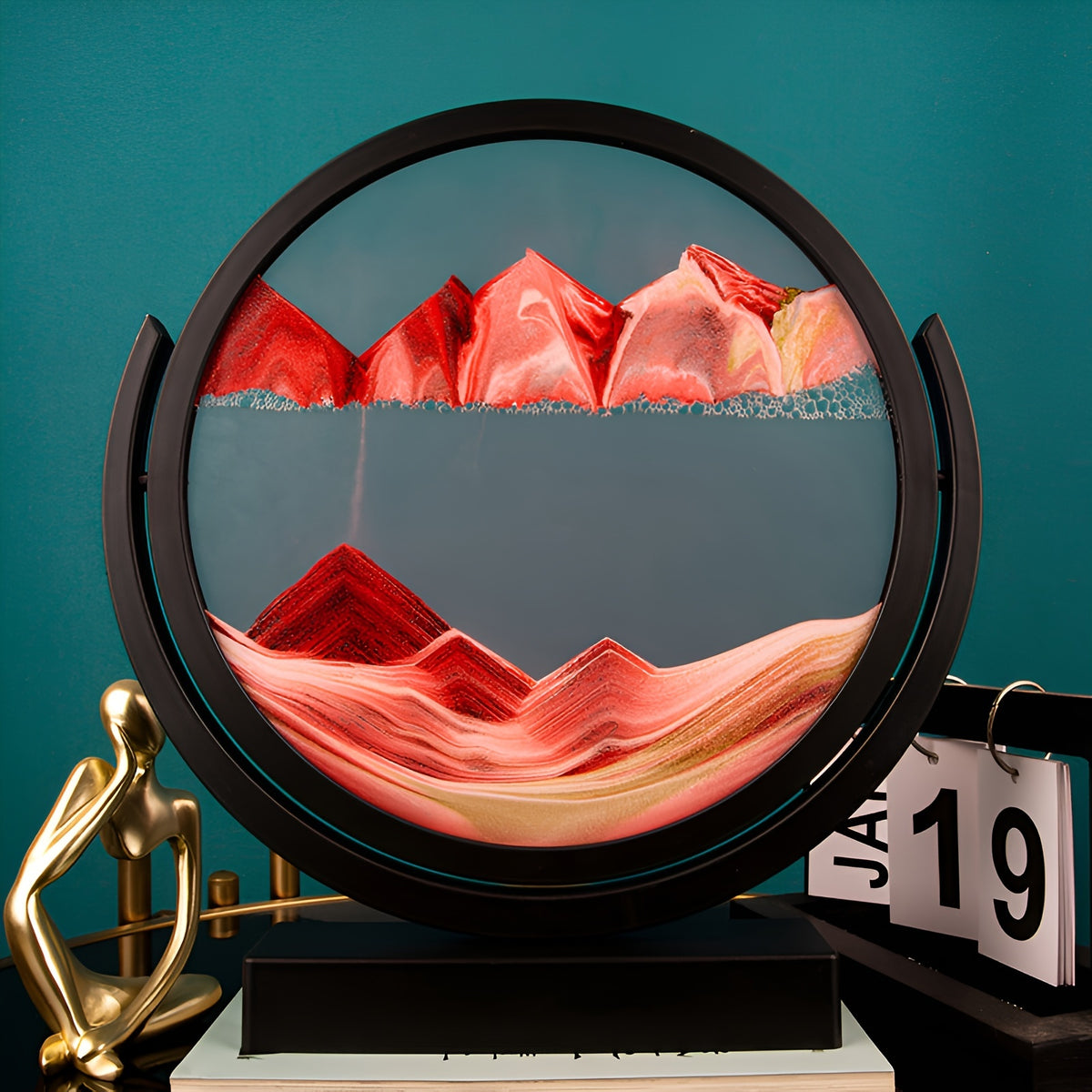 The red 3D sand art on a shelf